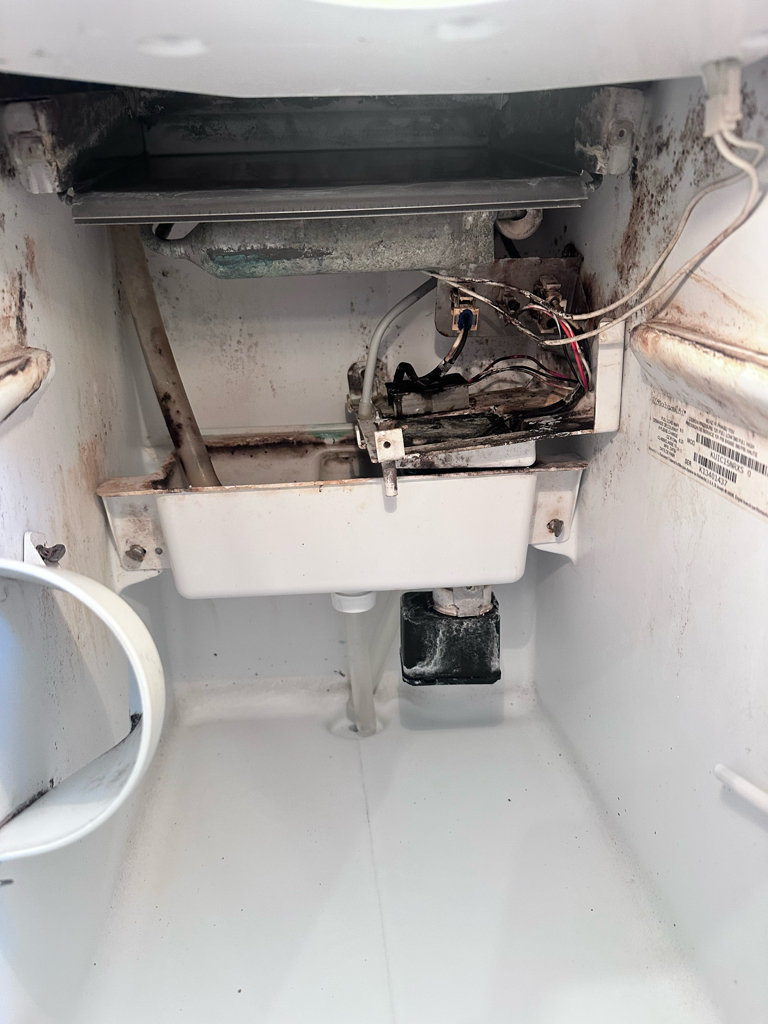 Dirty interior of an ice machine before cleaning